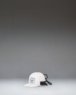 Herschel Supply Co. Sylas Classic Cap Bag Charm in the off-white Moonbeam colorway.