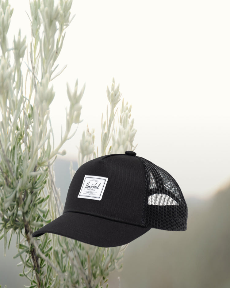 Herschel Supply Co. Whaler Cotton Mesh Toddler Cap in black, featuring a structured crown and mesh back panels.